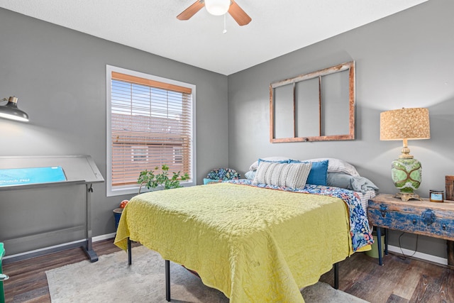 bedroom featuring ceiling fan and dark hardwood / wood-style floors