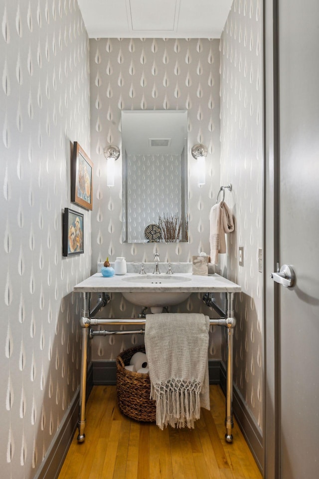 bathroom with sink and hardwood / wood-style floors