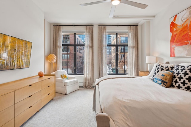 bedroom with light carpet and ceiling fan