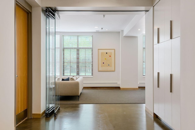 corridor featuring baseboards and a baseboard heating unit