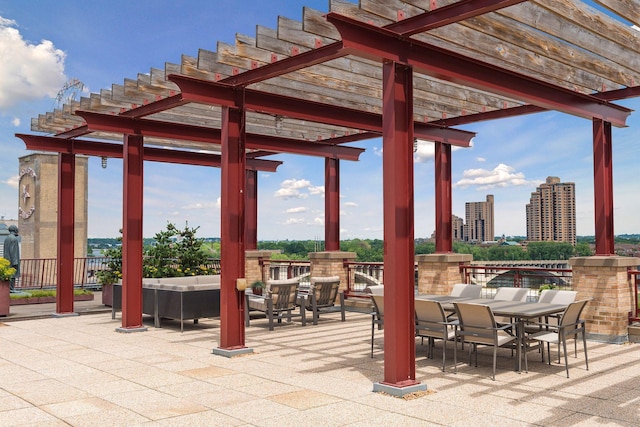 view of patio featuring outdoor lounge area, a pergola, and outdoor dining space