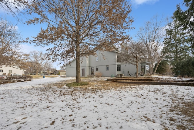 view of snow covered house