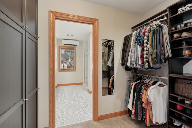 spacious closet with a wall unit AC and carpet floors