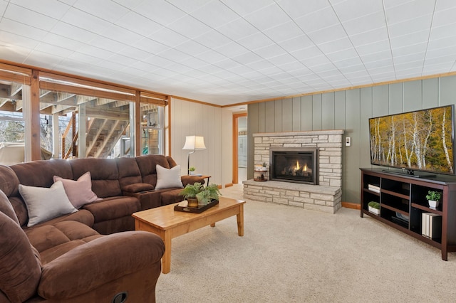 carpeted living area featuring a fireplace