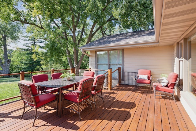 wooden terrace with outdoor dining area