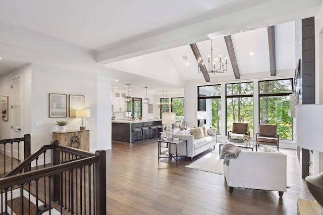 living room featuring dark hardwood / wood-style flooring, beamed ceiling, high vaulted ceiling, and an inviting chandelier