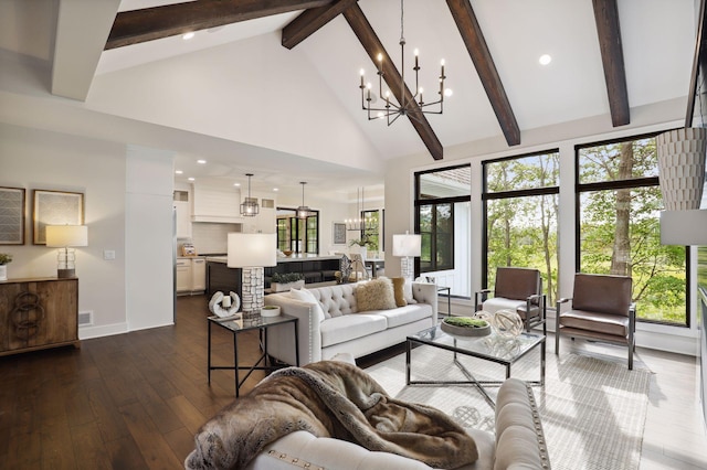 living room with plenty of natural light, dark hardwood / wood-style flooring, high vaulted ceiling, and an inviting chandelier