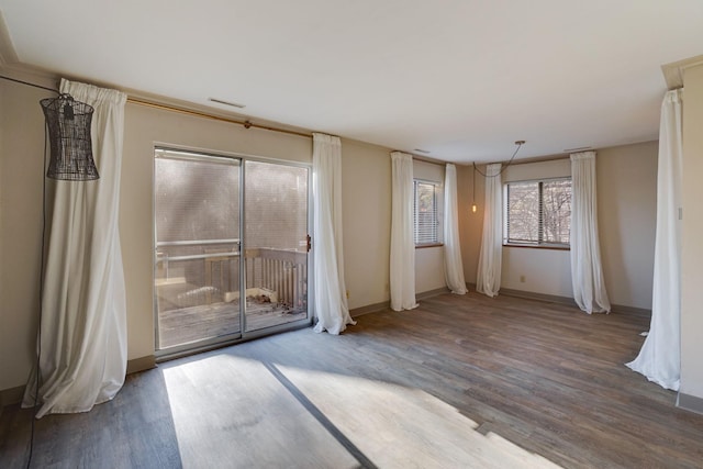 empty room with hardwood / wood-style floors