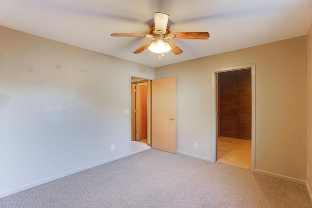 unfurnished bedroom featuring ceiling fan and light carpet