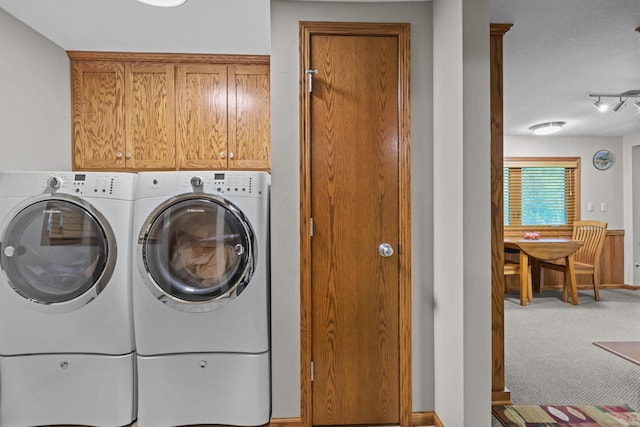19018 Troy St NW, Elk River, MN 55330 - laundry room with independent washer and dryer, cabinet space, and carpet floors