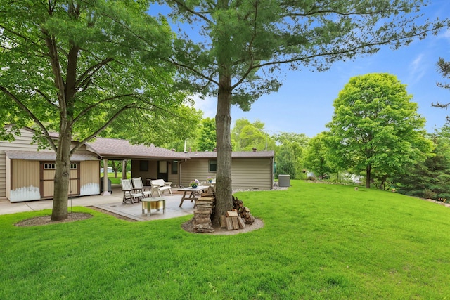 19018 Troy St NW, Elk River, MN 55330 - view of grassy yard featuring a patio area and a storage shed