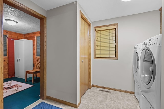 19018 Troy St NW, Elk River, MN 55330 - laundry area with independent washer and dryer and wood walls