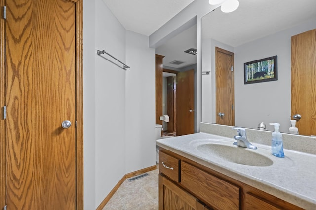 19018 Troy St NW, Elk River, MN 55330 - bathroom featuring vanity and tile patterned flooring