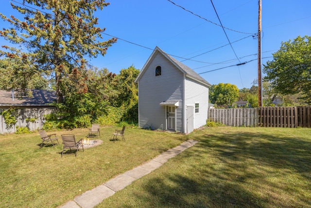 view of yard with an outdoor fire pit