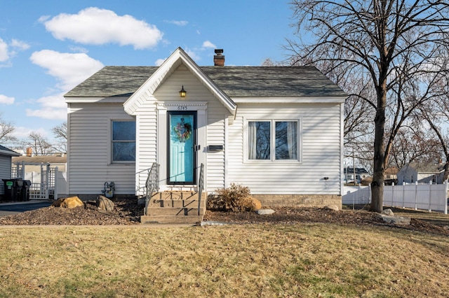 bungalow-style house with a front lawn