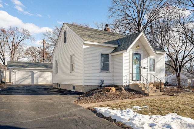 view of front of house with an outbuilding and a garage