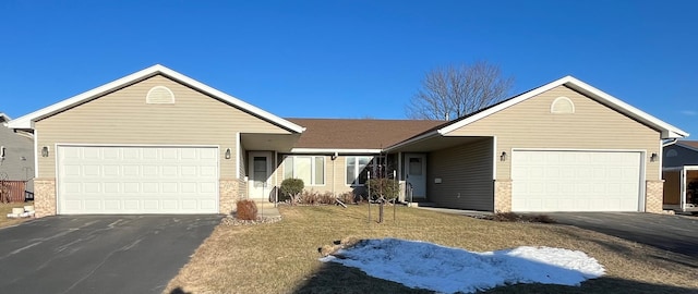 single story home with a garage