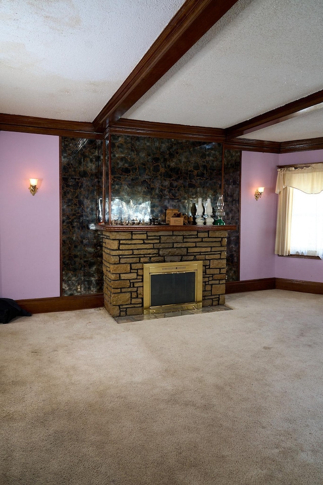 unfurnished living room featuring a textured ceiling, a fireplace, carpet flooring, and beam ceiling