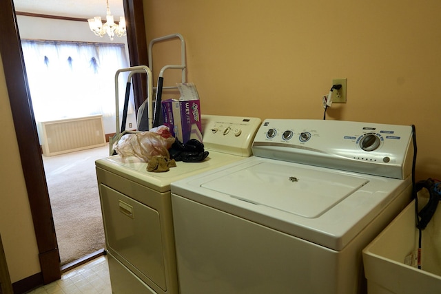 laundry area featuring a notable chandelier, washer and clothes dryer, light floors, visible vents, and laundry area