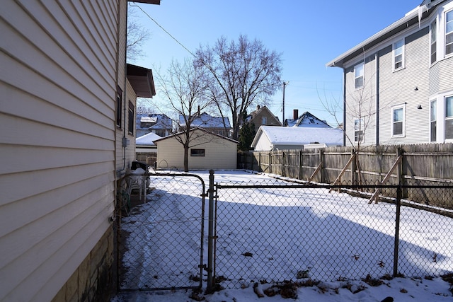 yard layered in snow featuring fence