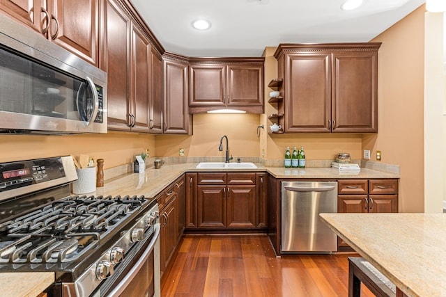 kitchen featuring light stone countertops, stainless steel appliances, beverage cooler, sink, and dark hardwood / wood-style floors