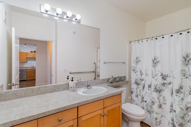 bathroom with vanity, toilet, and curtained shower