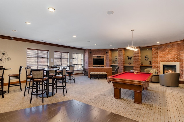 game room featuring crown molding, a fireplace, and billiards