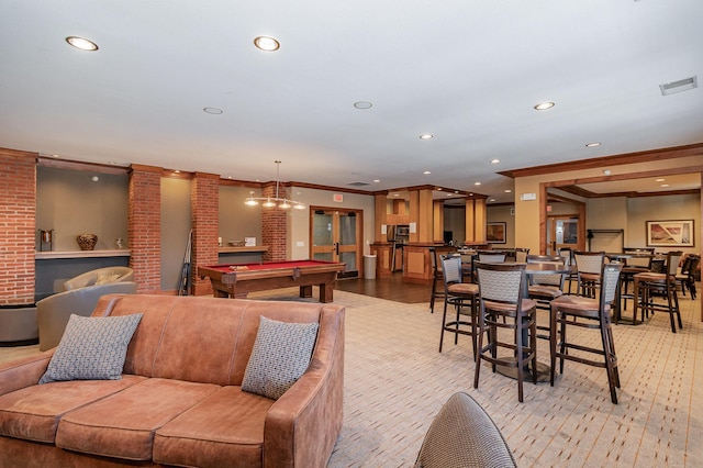 playroom featuring light hardwood / wood-style floors, crown molding, and pool table