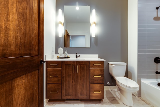 full bathroom featuring vanity, toilet, bathing tub / shower combination, baseboards, and tile patterned floors