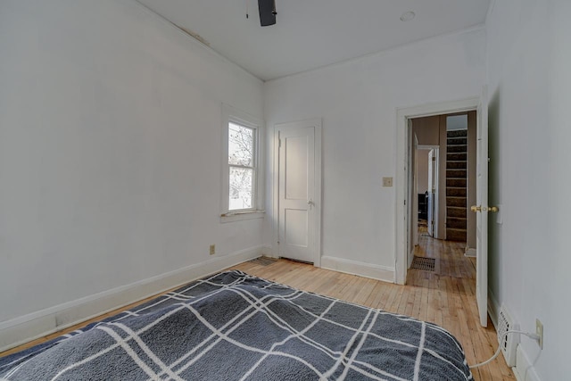 unfurnished bedroom featuring ceiling fan and light hardwood / wood-style flooring