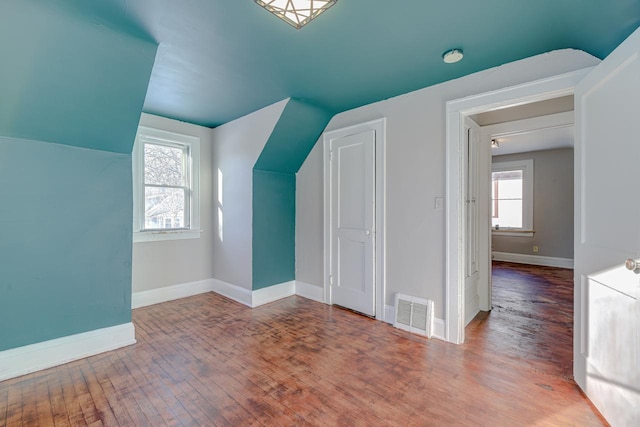 bonus room featuring wood-type flooring and lofted ceiling