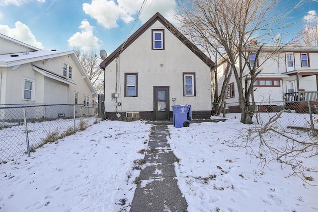 view of snow covered house