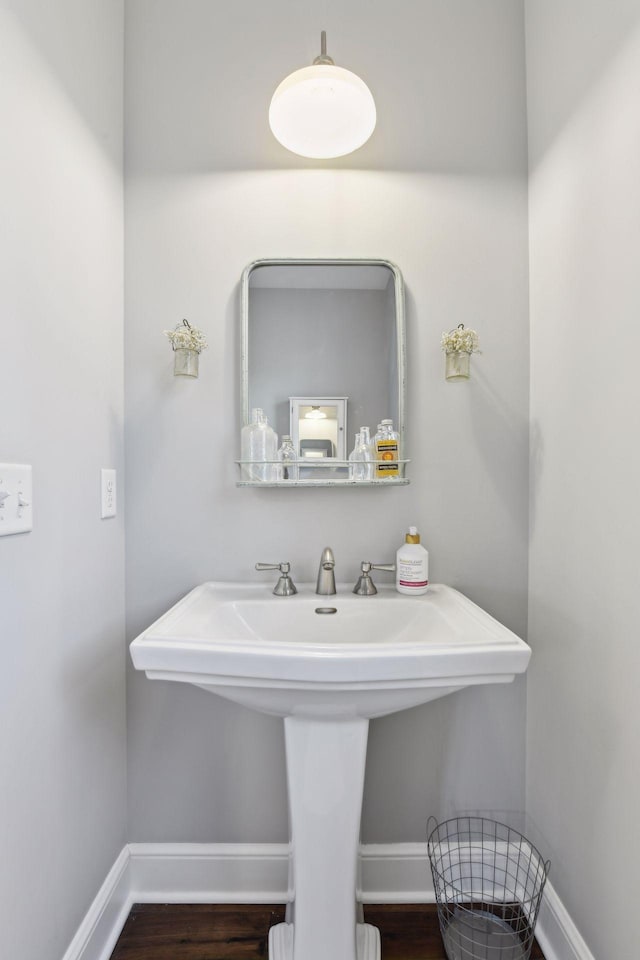 bathroom featuring sink and hardwood / wood-style floors