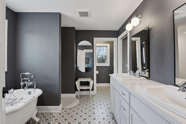 bathroom featuring a tub to relax in and vanity