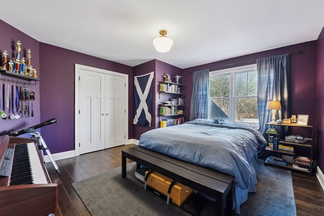 bedroom featuring dark hardwood / wood-style floors and a closet