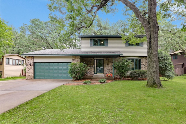 8385 Pleasant View Dr, Mounds View, MN 55112 - traditional-style house with an attached garage, brick siding, driveway, and a front yard