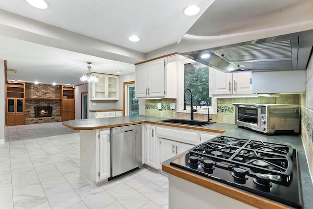 8385 Pleasant View Dr, Mounds View, MN 55112 - kitchen featuring dishwasher, extractor fan, black gas stovetop, a peninsula, and white cabinetry