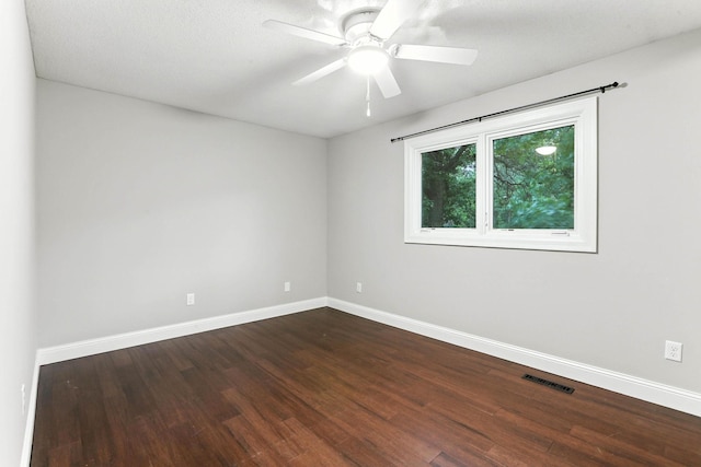 8385 Pleasant View Dr, Mounds View, MN 55112 - spare room featuring dark wood-type flooring and a ceiling fan