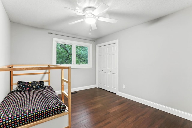 8385 Pleasant View Dr, Mounds View, MN 55112 - bedroom featuring wood finished floors, a closet, and a ceiling fan
