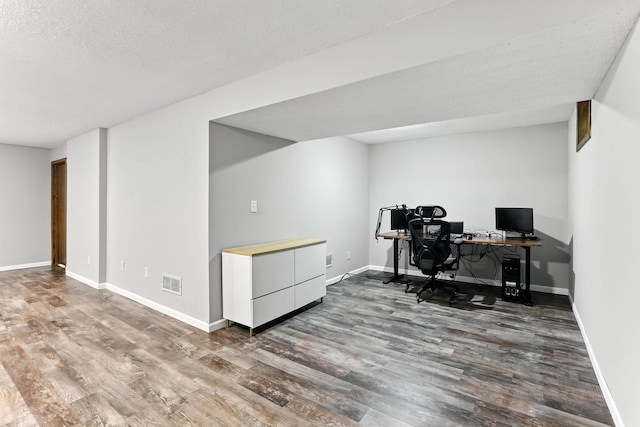 8385 Pleasant View Dr, Mounds View, MN 55112 - home office featuring wood finished floors and a textured ceiling