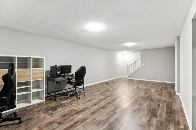 8385 Pleasant View Dr, Mounds View, MN 55112 - home office with wood finished floors and a textured ceiling