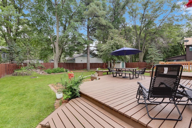 8385 Pleasant View Dr, Mounds View, MN 55112 - deck featuring outdoor dining space and a fenced backyard
