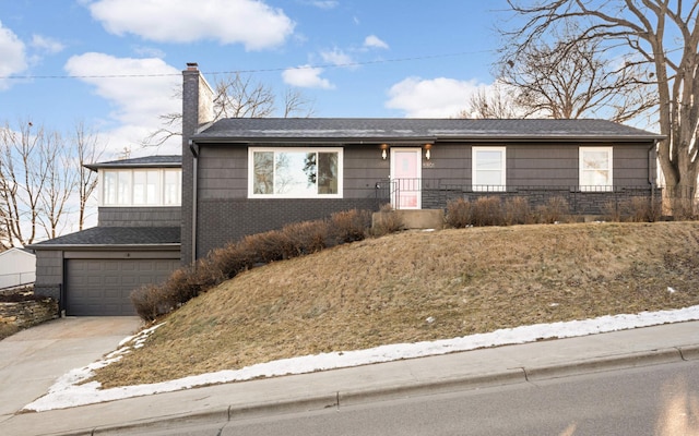 ranch-style house featuring a garage