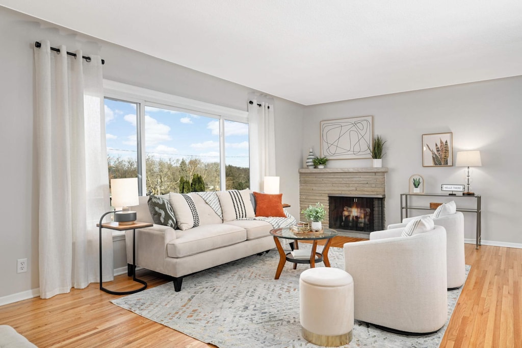 living room with a fireplace and hardwood / wood-style floors