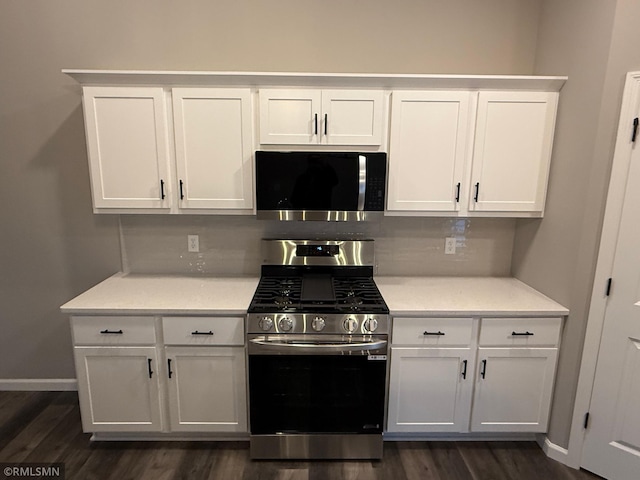 kitchen featuring white cabinets and appliances with stainless steel finishes