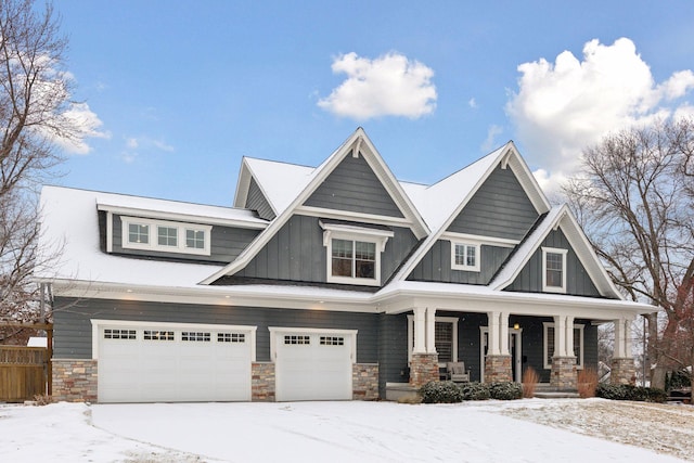 craftsman-style house with covered porch and a garage