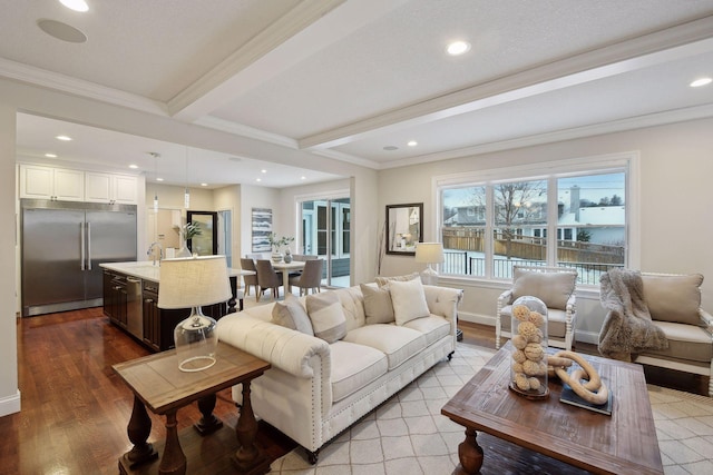 living room with beam ceiling, wood-type flooring, and crown molding