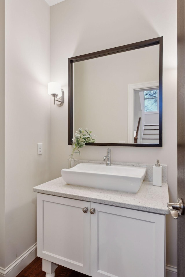 bathroom featuring vanity and hardwood / wood-style flooring