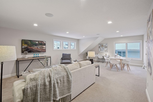 carpeted living room with plenty of natural light