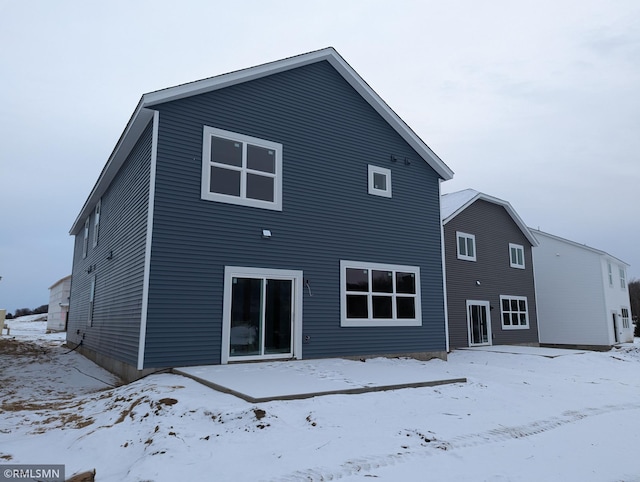 view of snow covered house